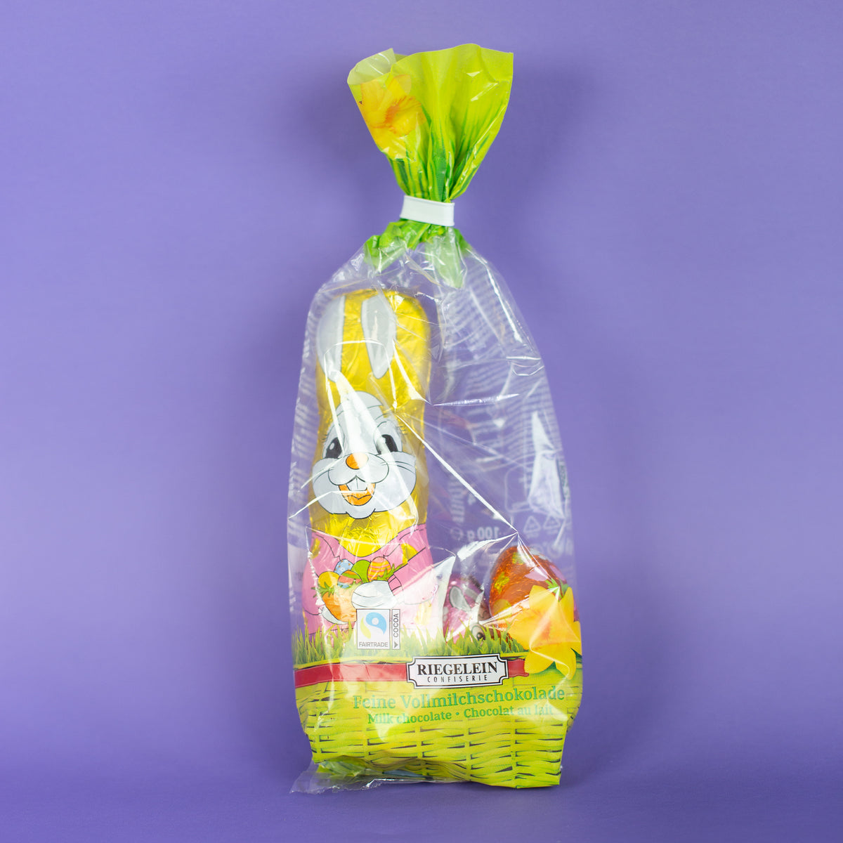 Riegelein Oster-Mischbeutel 100g liegend auf einem lila Untergrund