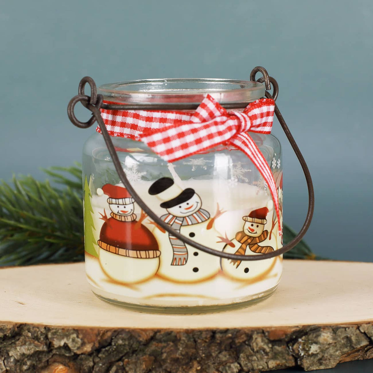 Fröhliches Schneemann Motiv auf Glas mit Kerze