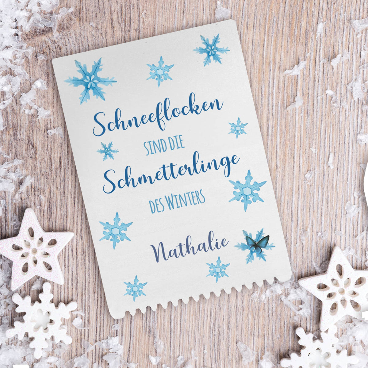 Eiskratzer mit Schneeflocken