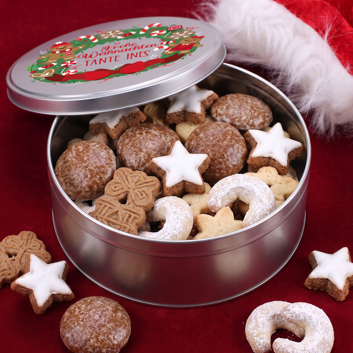 Geöffnete Keksdose mit Weihnachtsplätzchen und personalisiertem Lebkuchen Motiv
