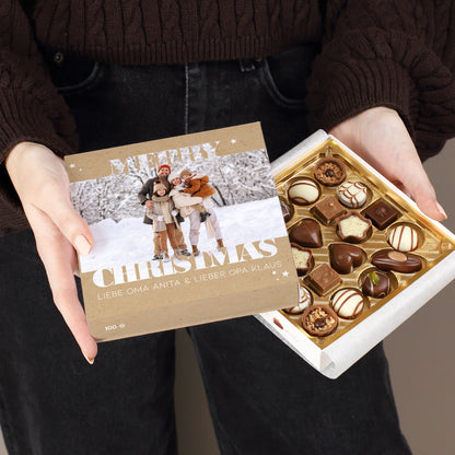 Personalisierte Lindt Pralinen Merry Christmas mit Foto und Wunschtext auf der Vorderseite.