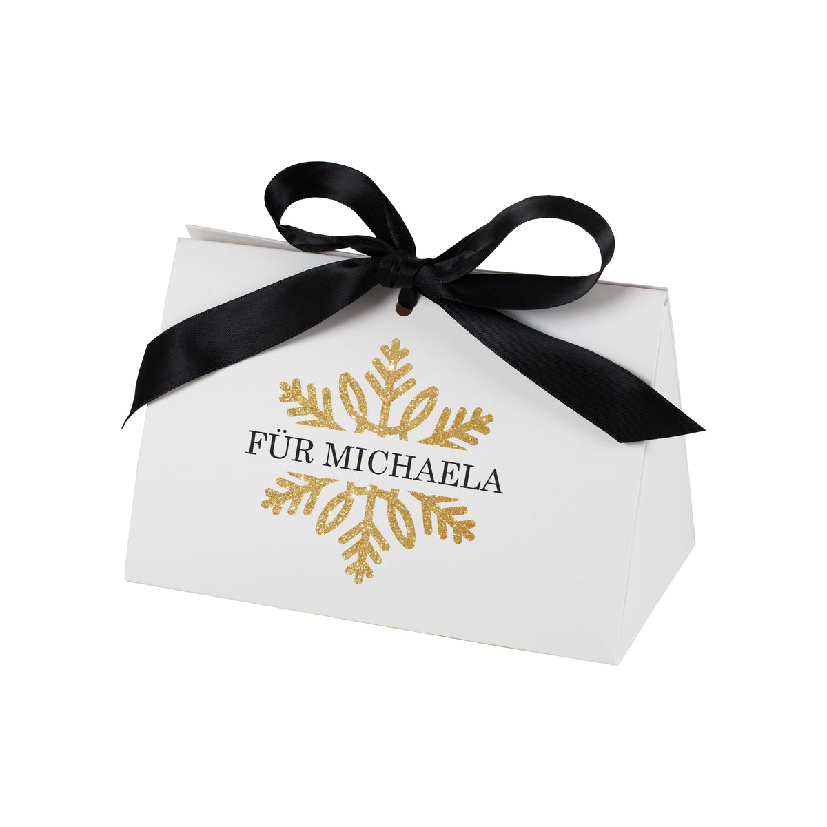 Freigestellte Geschenkverpackung in kleiner Größe mit goldener Schneeflocke und personalisiertem Text „Für Michaela“, vor weißem Studiohintergrund.